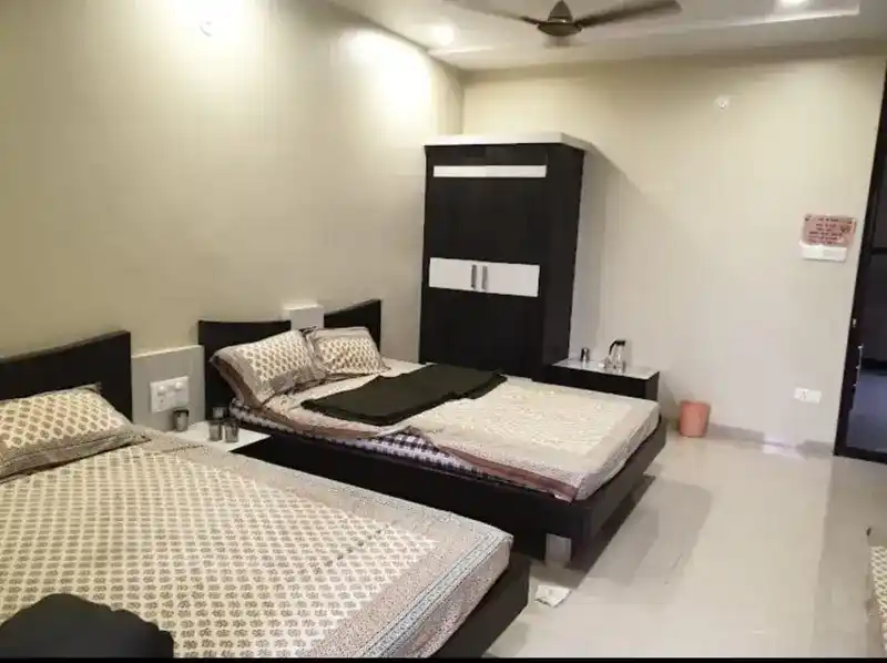 Clean non-AC room for pilgrims at Shyam Sakha Sadan Khatu